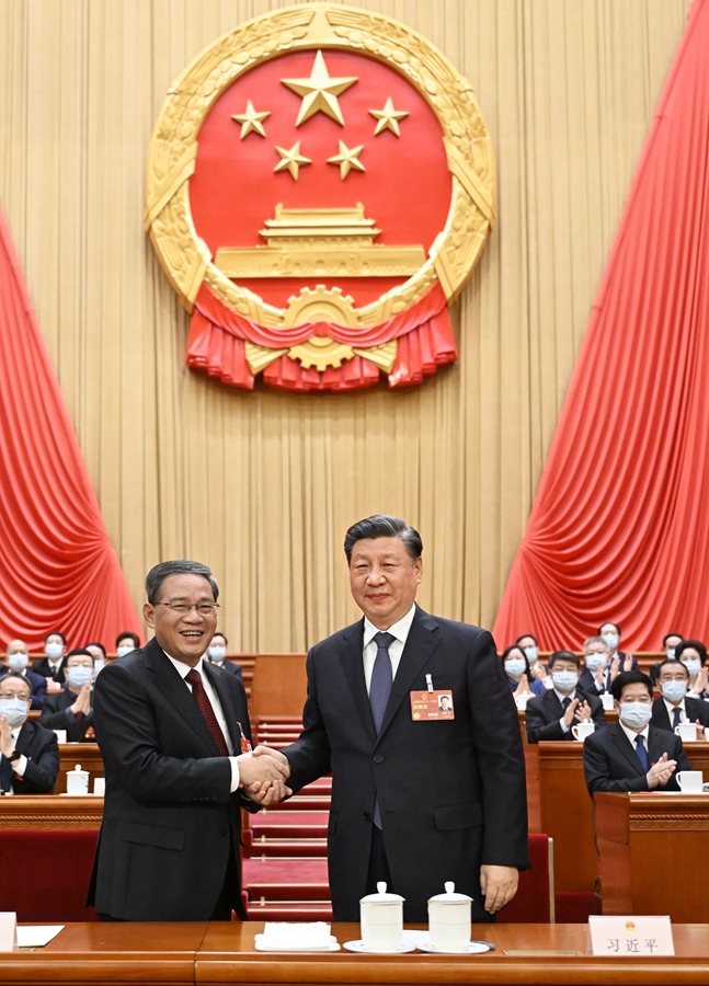 十四届全国人大一次会议举行第四次全体会议根据国家主席习近平的提名决定李强为国务院总理国家主席习近平签署主席令任命